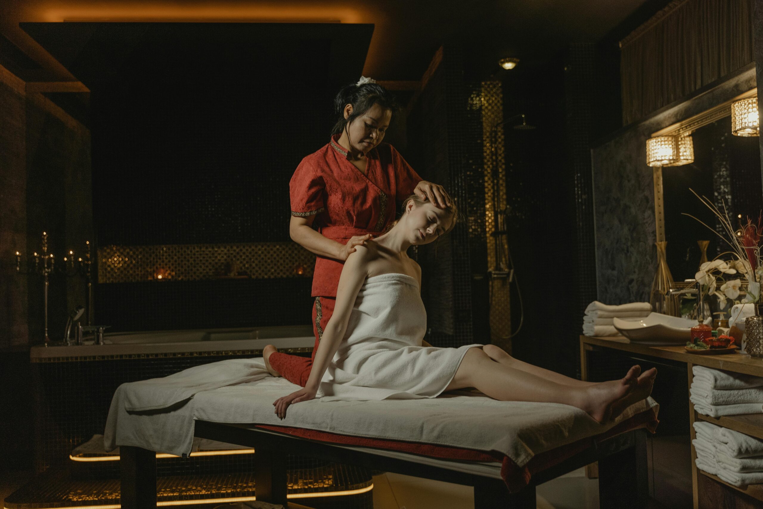 A serene spa massage session with a therapist providing a calming treatment indoors.